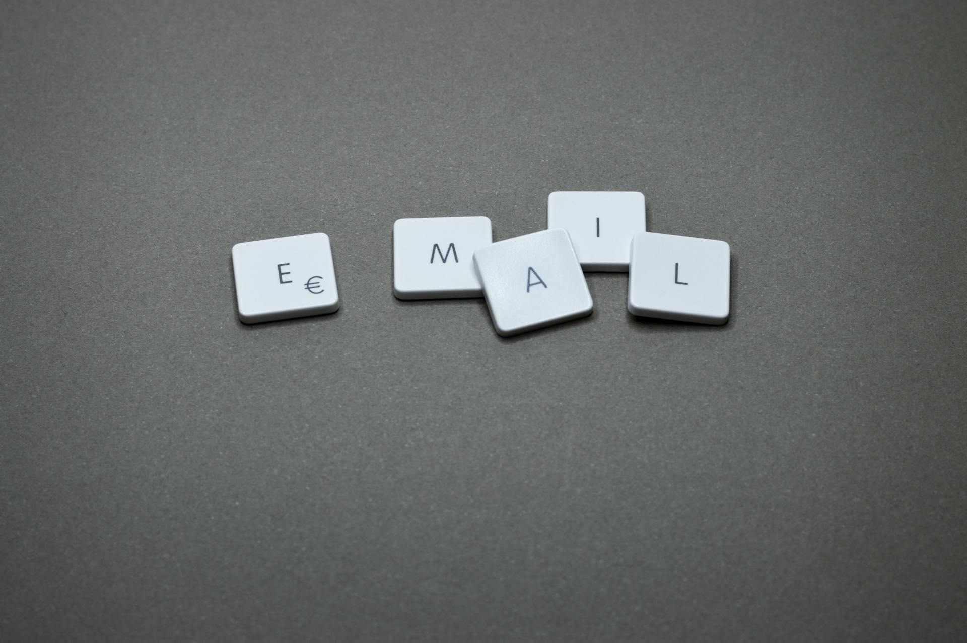 Close-up photo of a keyboard with the letters E, M, A, and L spelled out on the keys