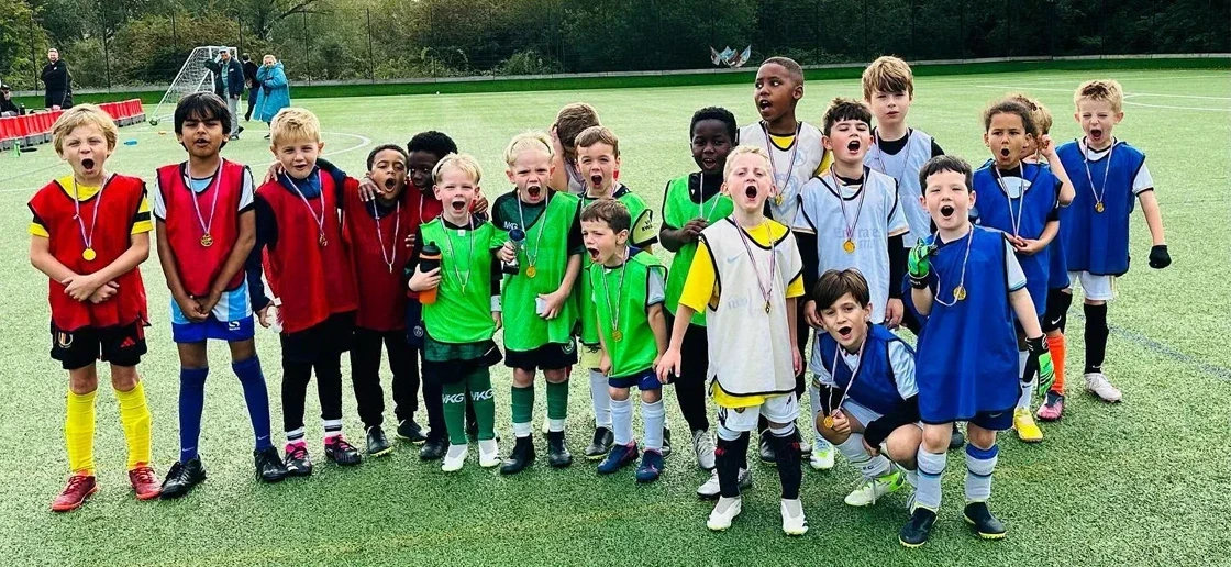 Kids with football medals