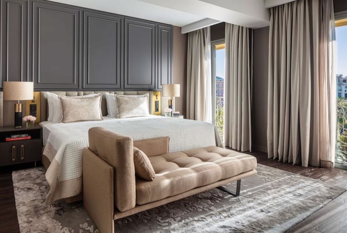 3D model of a cozy bedroom in a hexagonal shape, displayed on a circular black marble base. (Background Removed)