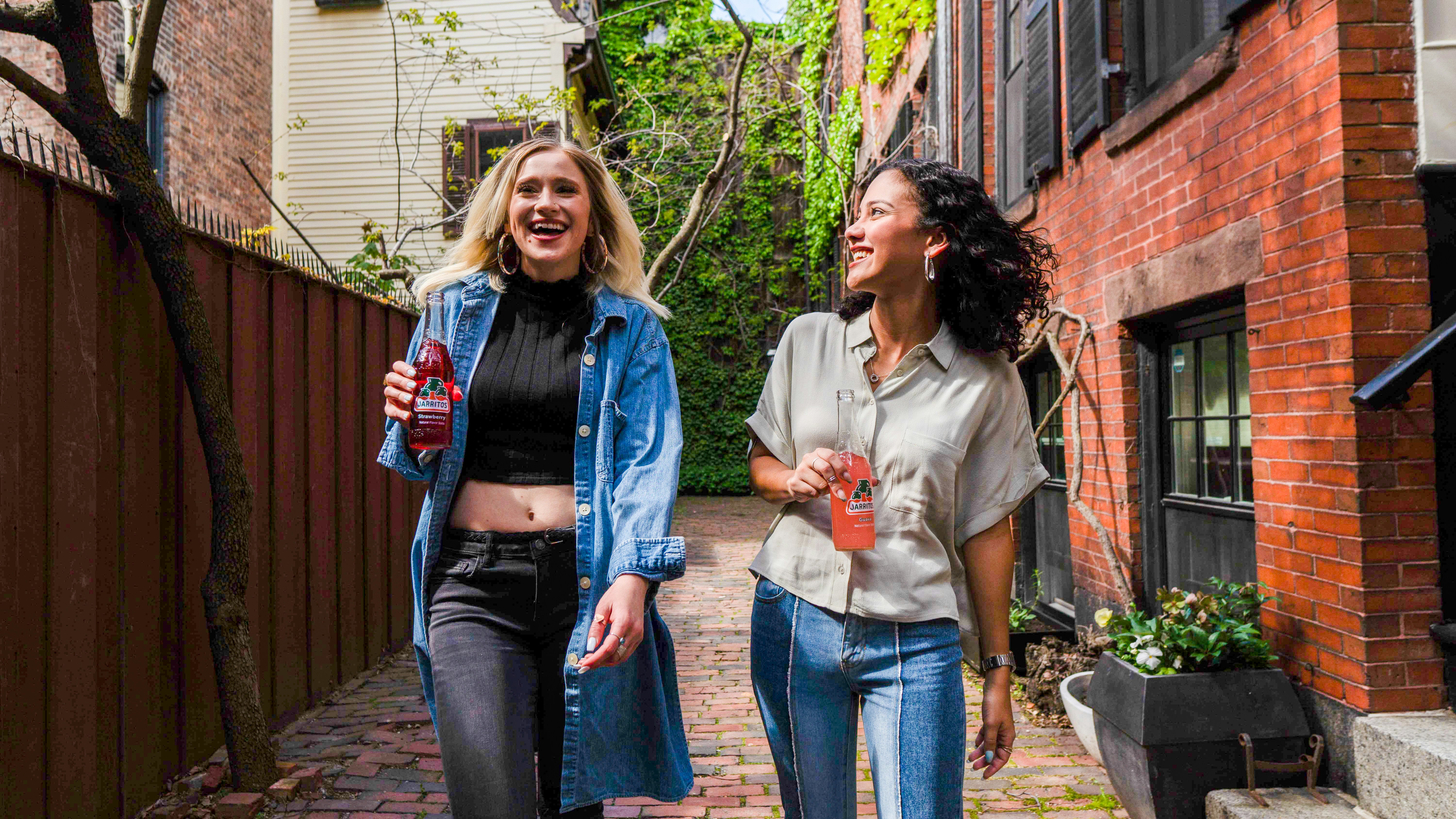 woman walking with a friend - Fall Game Day Outfits