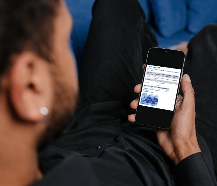 Man looking at notification from his florist of his flower delivery