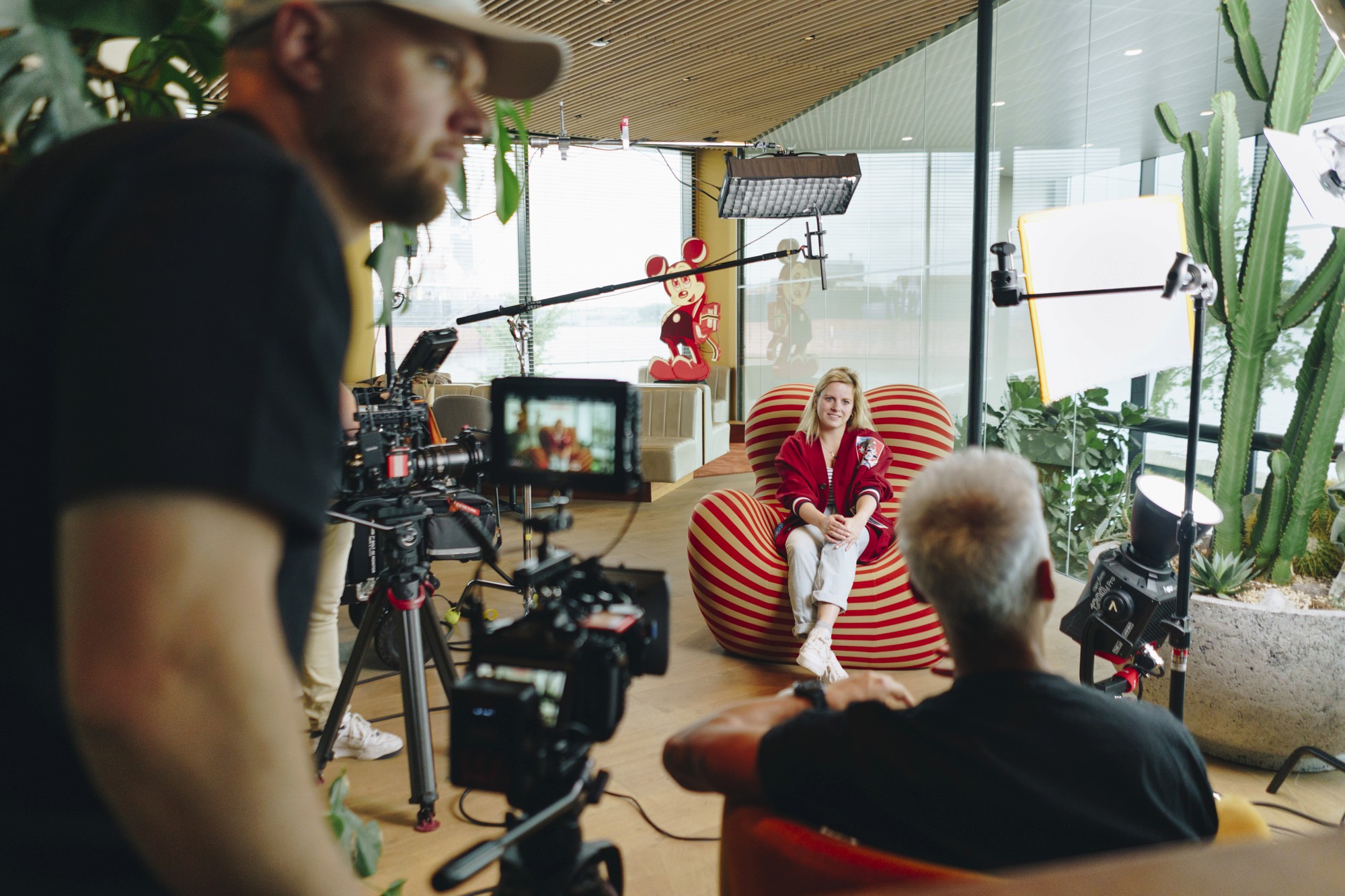 The image captures the ethereal beauty of an underwater cave illuminated by sunbeams penetrating through an opening above.