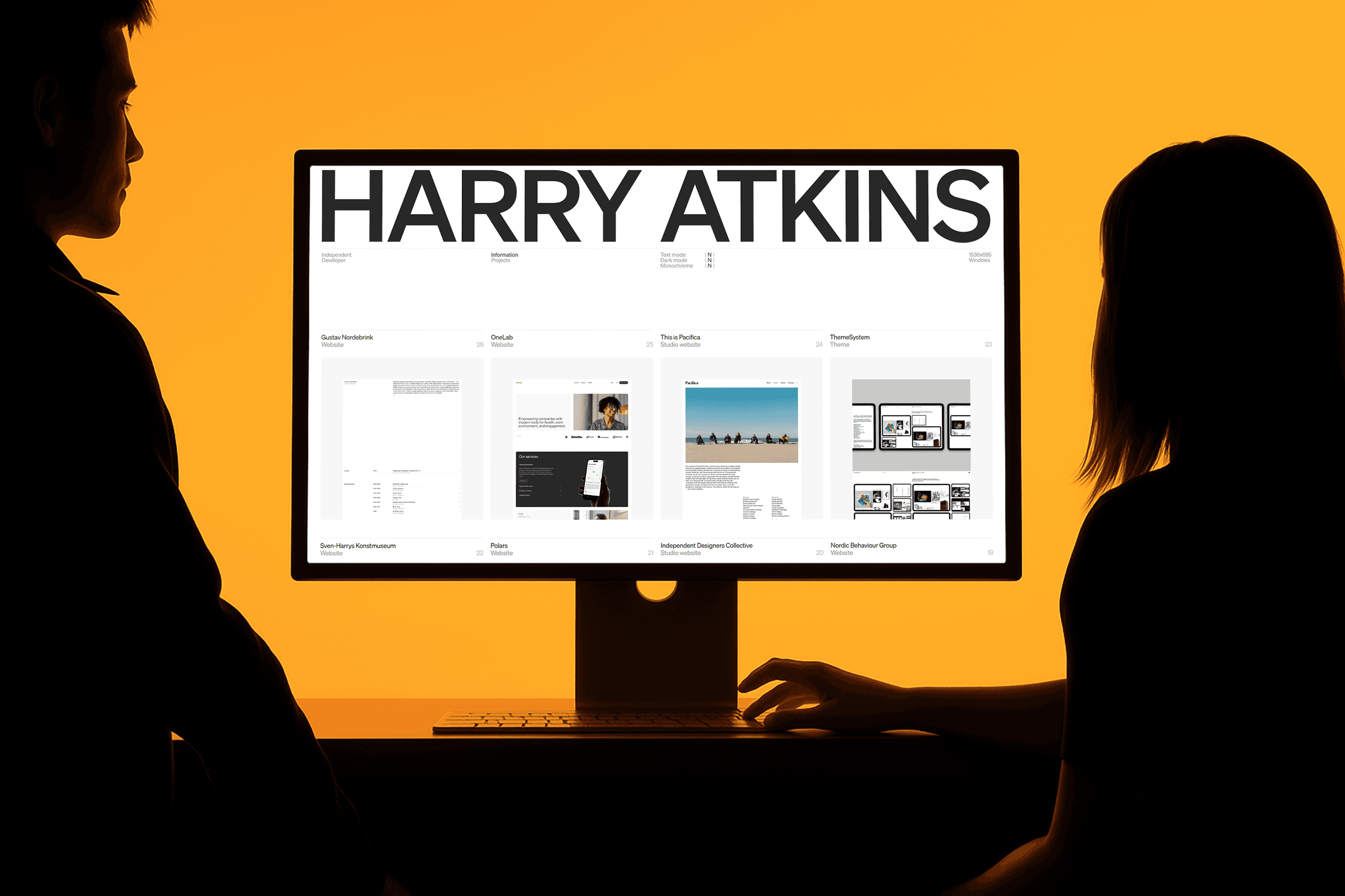 silver iMac turned on inside room