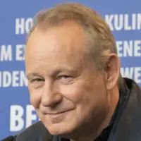 Stellan Skarsgård against a blue background