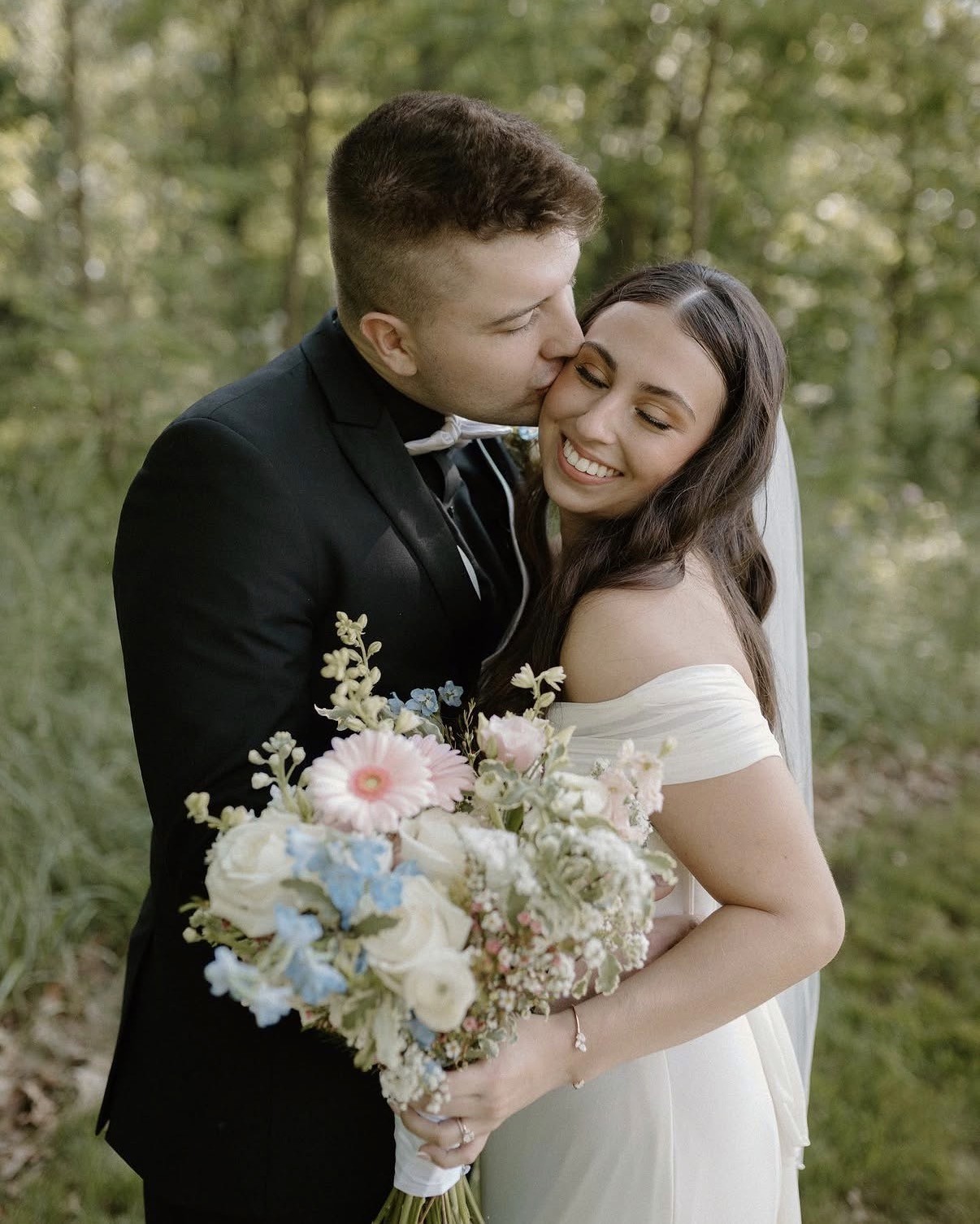 A model surrounded by photographers holding cameras