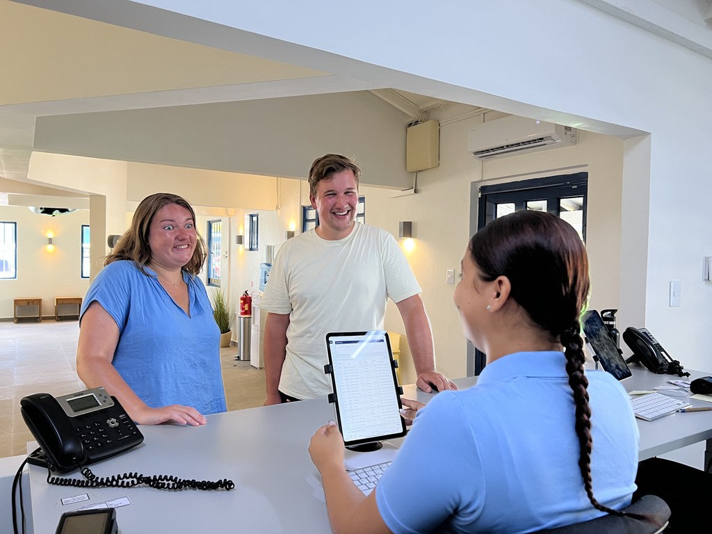 AB Dive Receptionist with customers