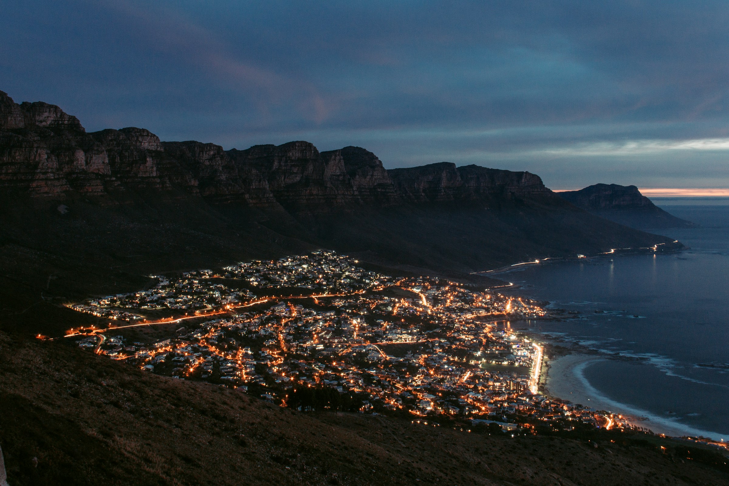 Camps Bay at blue hour, street lights on