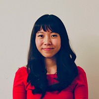 man filming on beach
