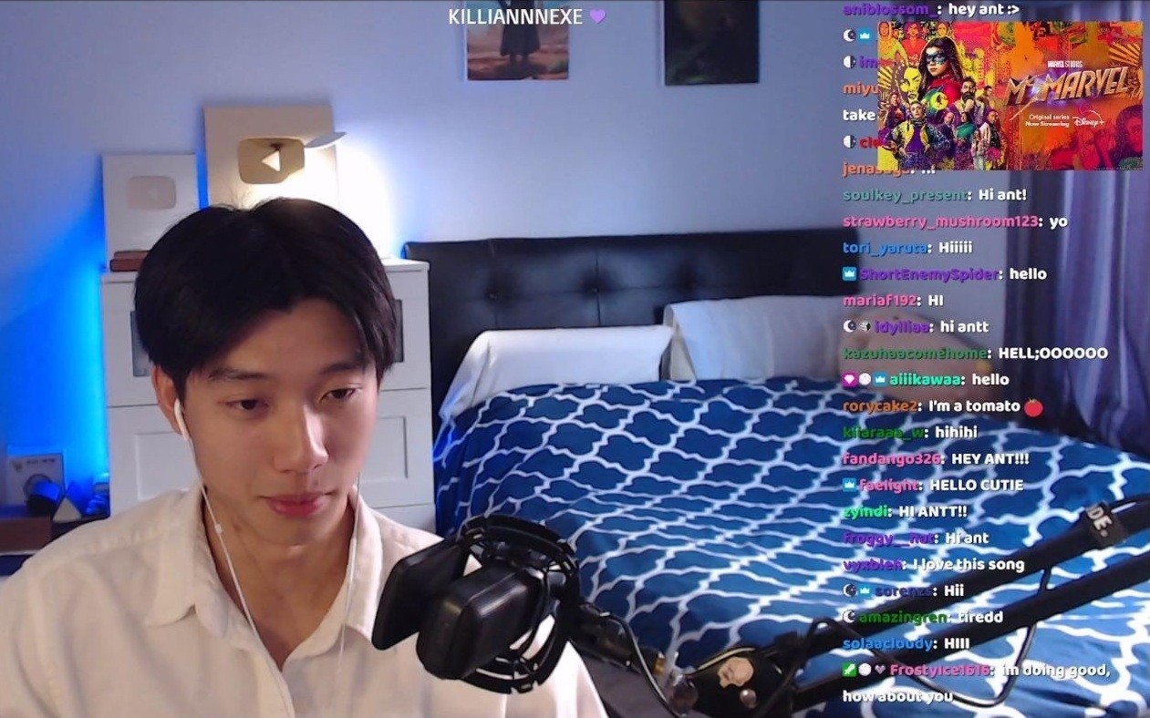 AntonyChenn on stream in his bedroom, with the Ms. Marvel overlay above his chat