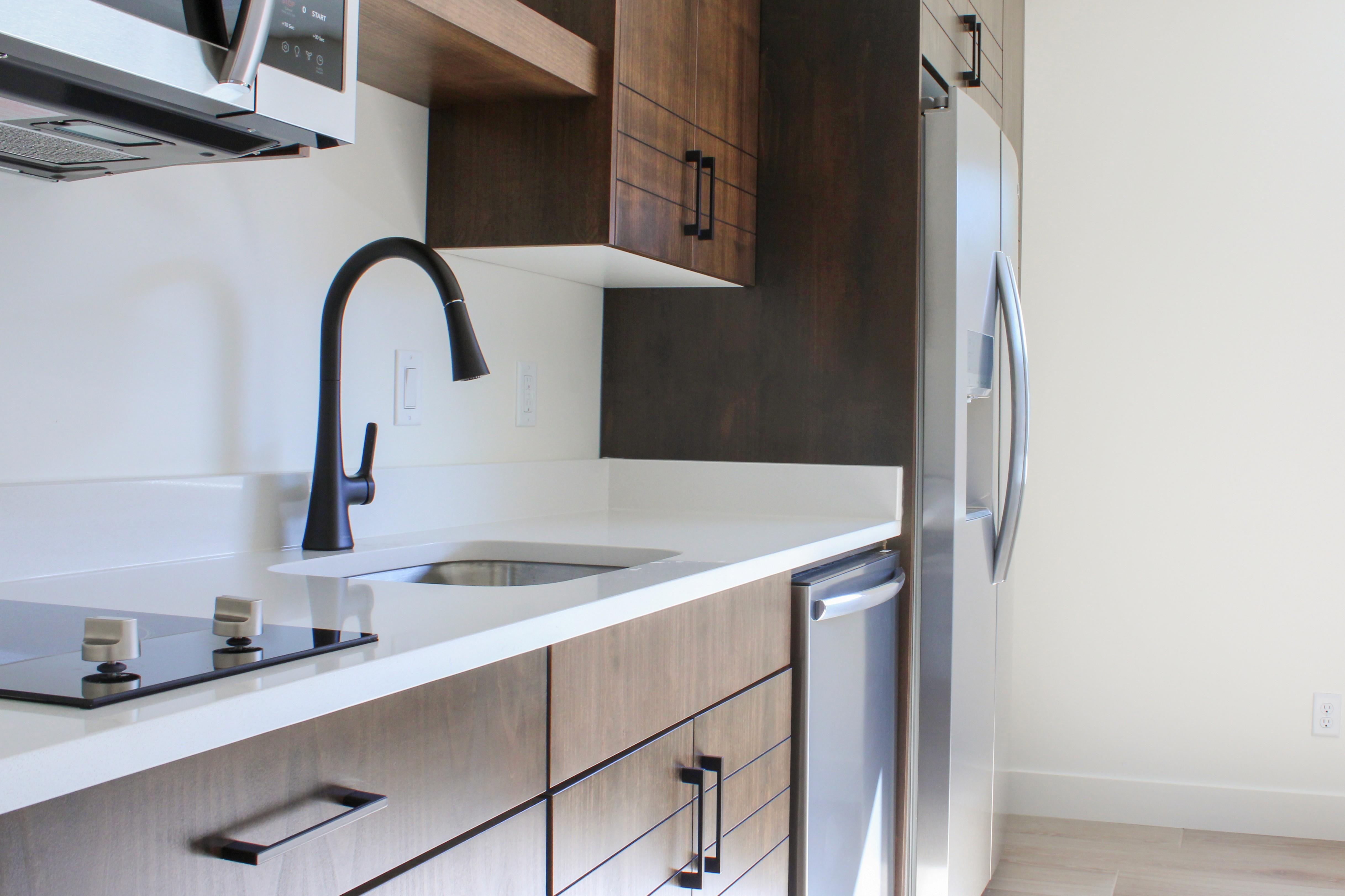 Custom home casita kitchen with a matte black pulldown faucet in Hurricane, Utah.