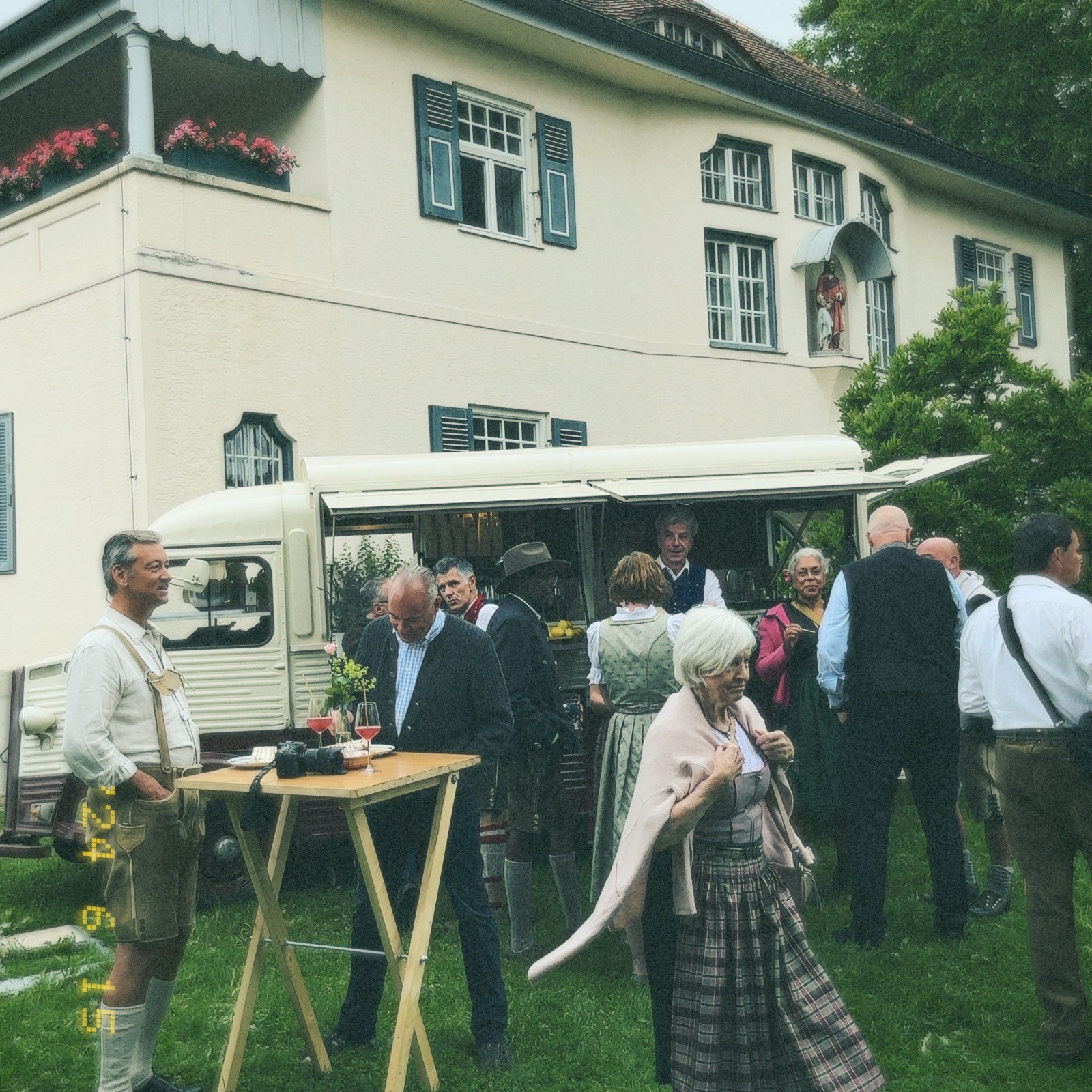 woman in wedding dress while holding flower during daytime