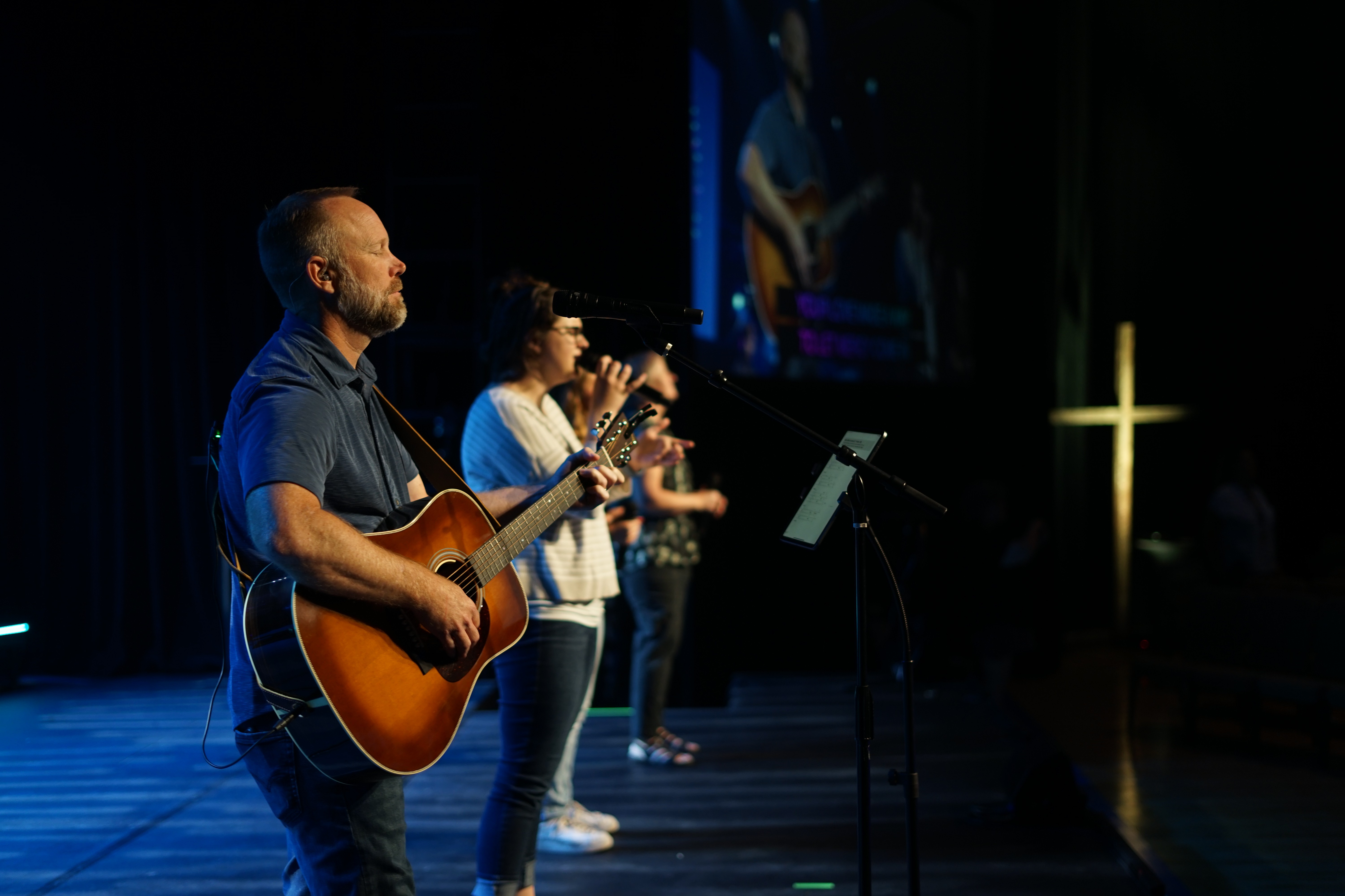 Large outdoor billboard amid trees, showing a purple-to-peach gradient background with the white text “Your mental health, simplified.” and a small purple gradient pill-shaped logo above the word “Circular.”