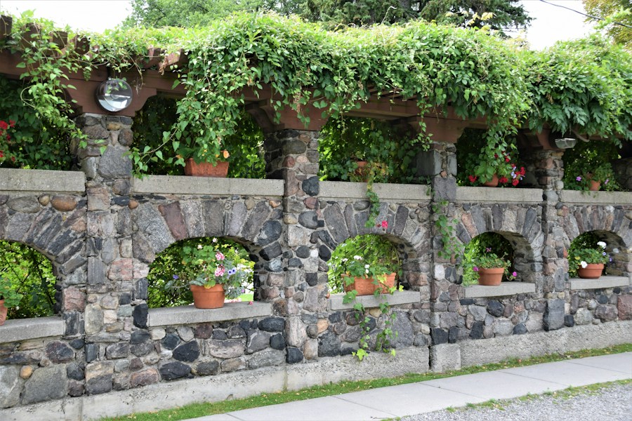 Residential stone retaining wall and landscaped garden