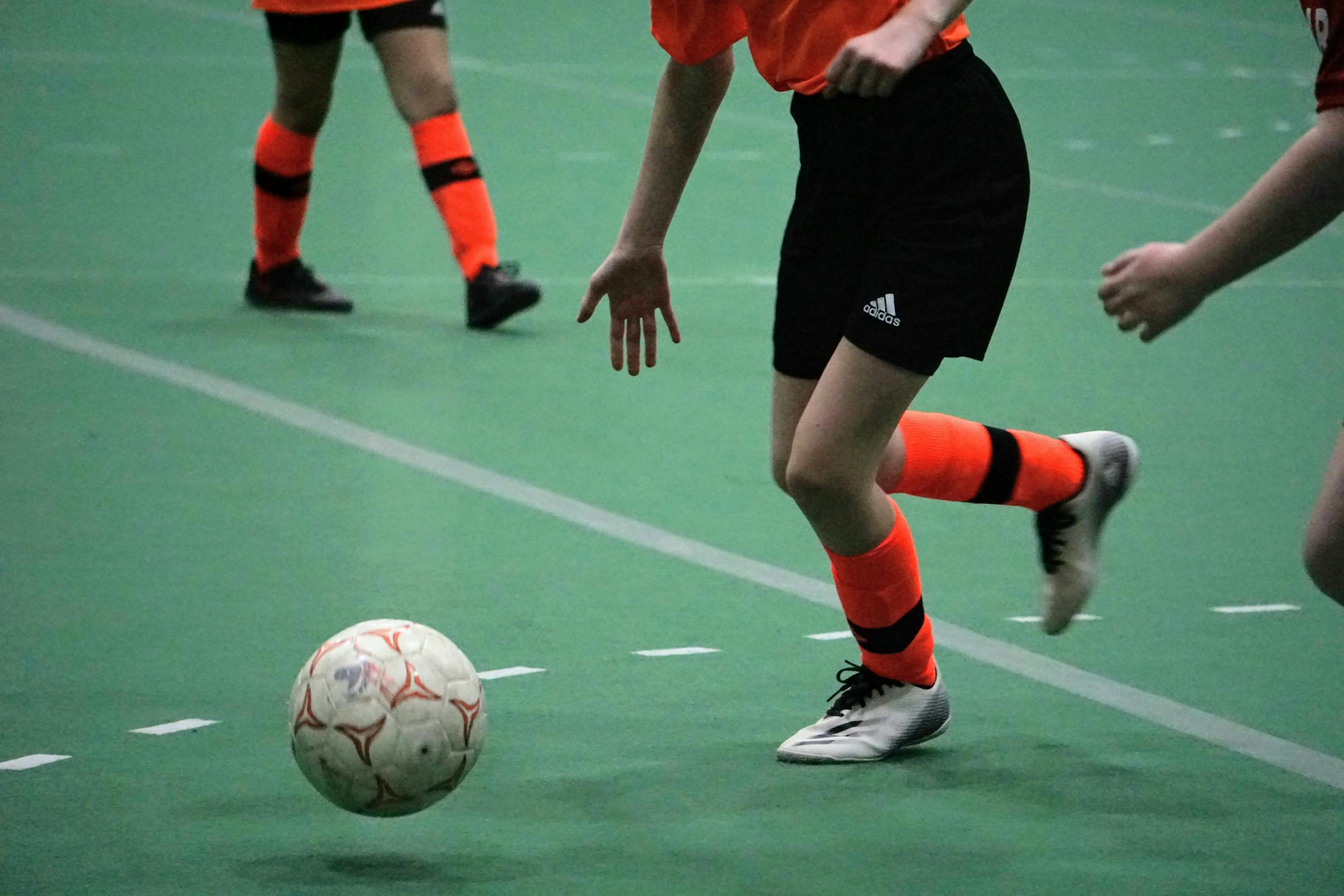 a group of young people playing a game of soccer
