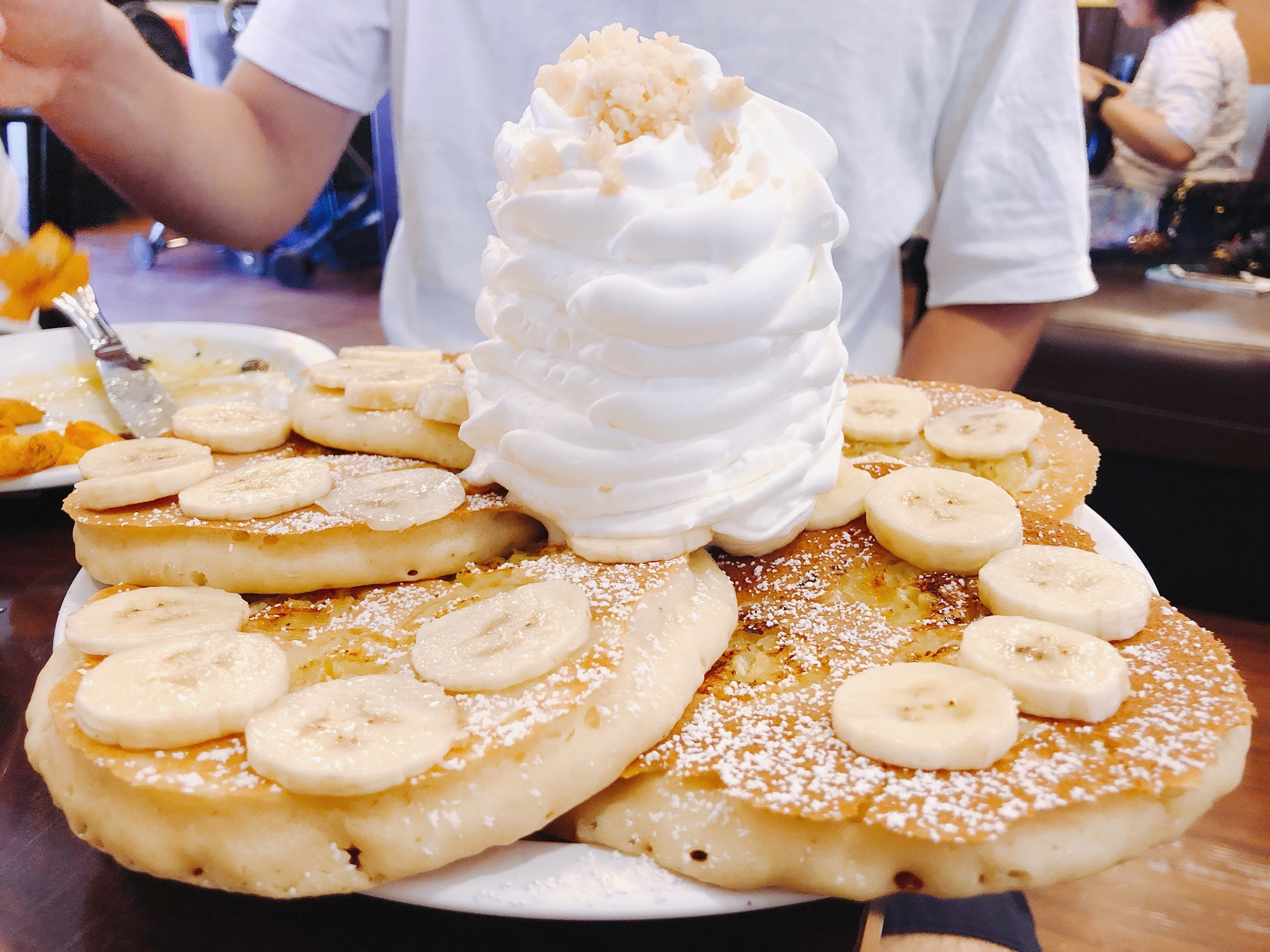 a person is holding a bowl of ice cream