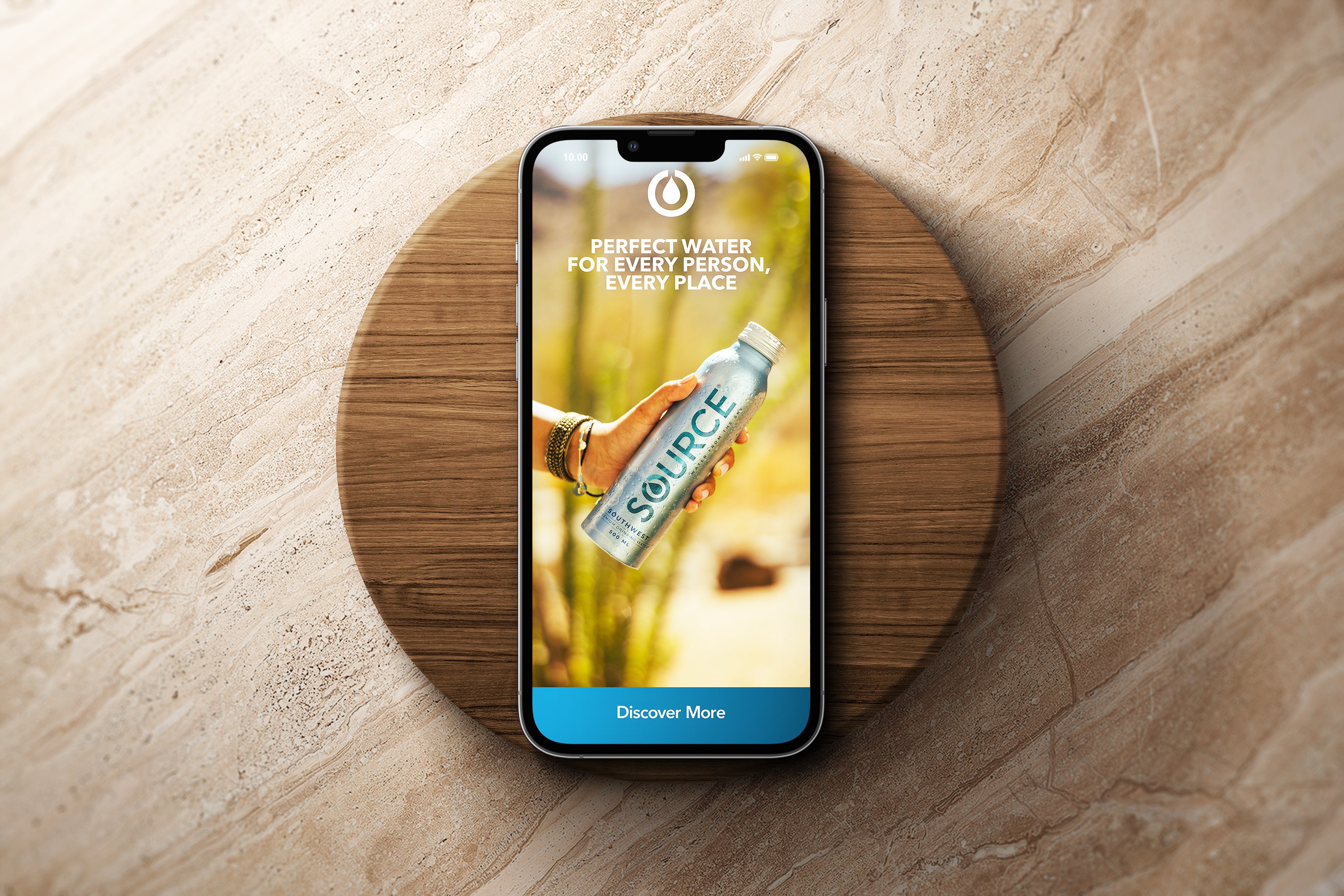 SOURCE Digital Guidelines showcasing iPhone design screen on a wooden background.