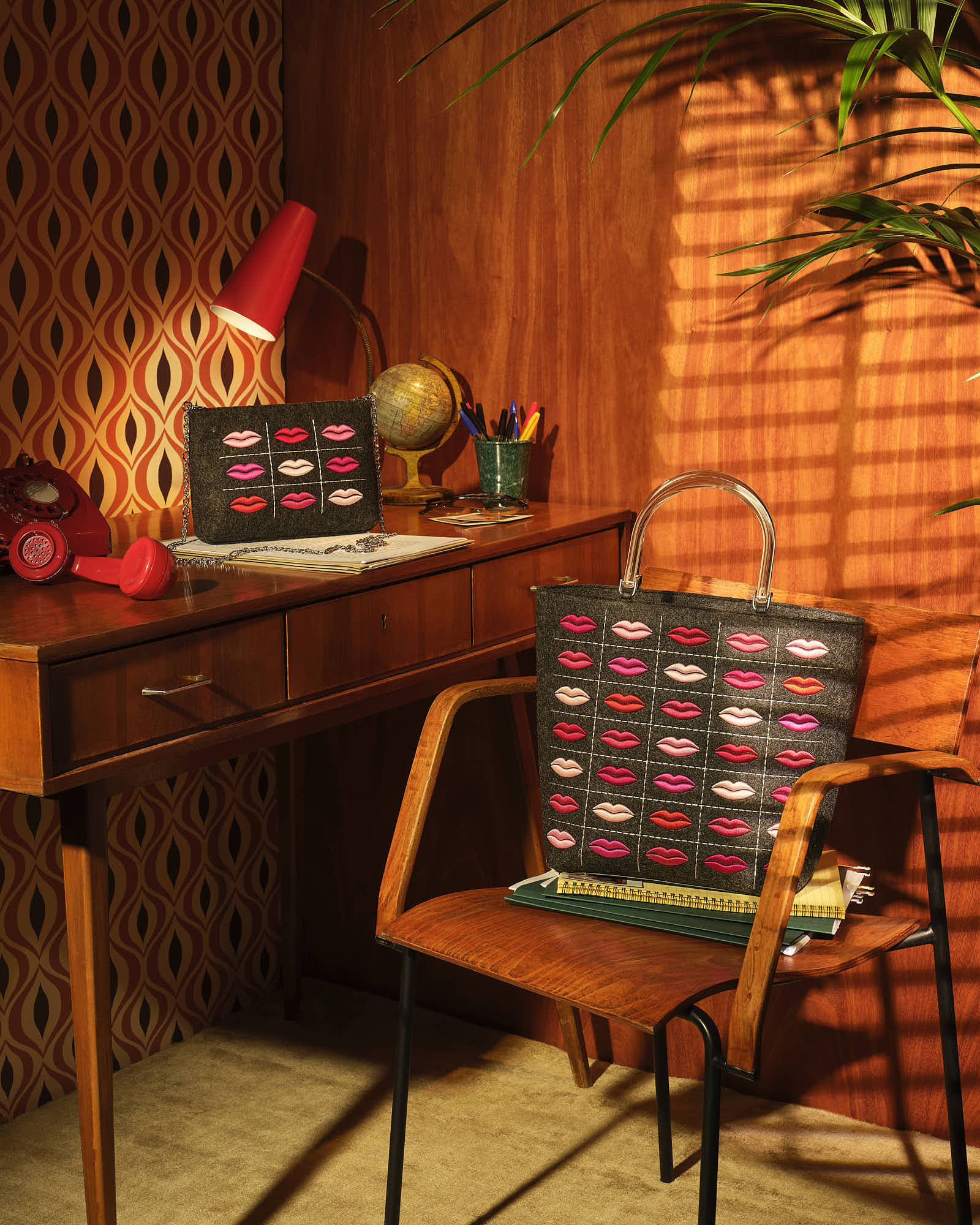 Retro office decor with lip-print bags on wooden desk and chair, vintage style.