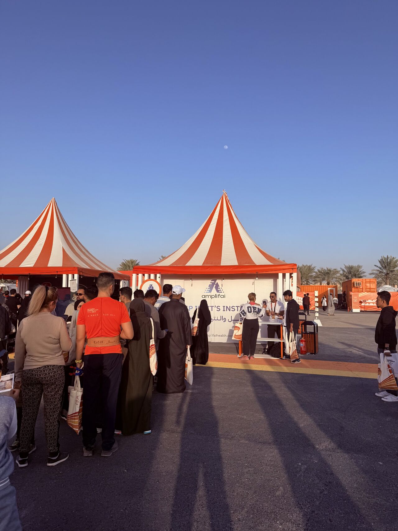 Attendees queuing for a NUR scan at the event