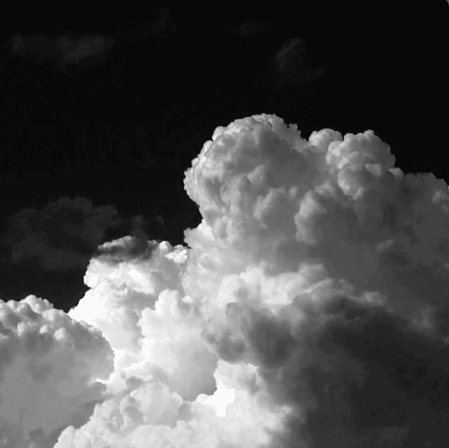 Hiraco Realty logo on steel-grey building facade, reflecting modernist architecture and legacy solidity