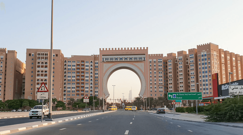 Aerial view of Dubai Investment Park roads, showcasing well-maintained streets and surrounding greenery.