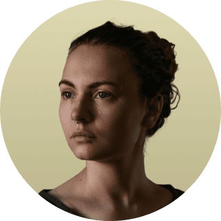 woman in white crew neck shirt smiling