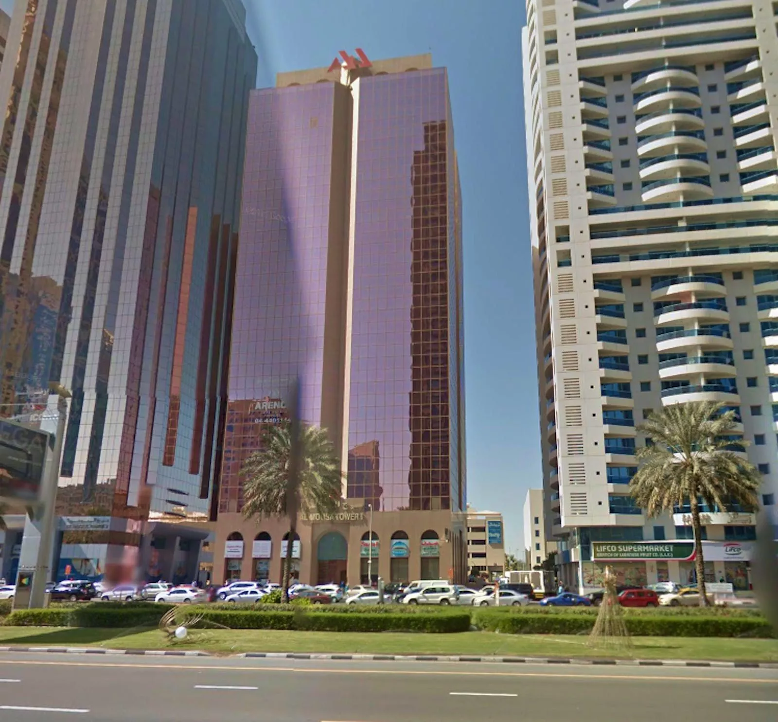 A closer view of the entrance at Al Moosa Tower 2. Premium real estate listings and tenant services available.