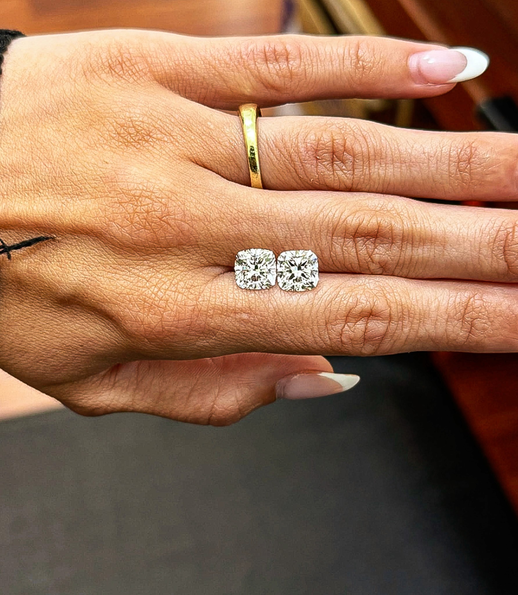 A Pair of Cushion cut lab-grown diamond with pillow-like soft corners.