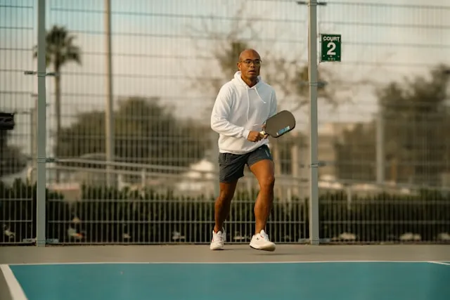 Tennis sportman is playing on the cort, fully energized