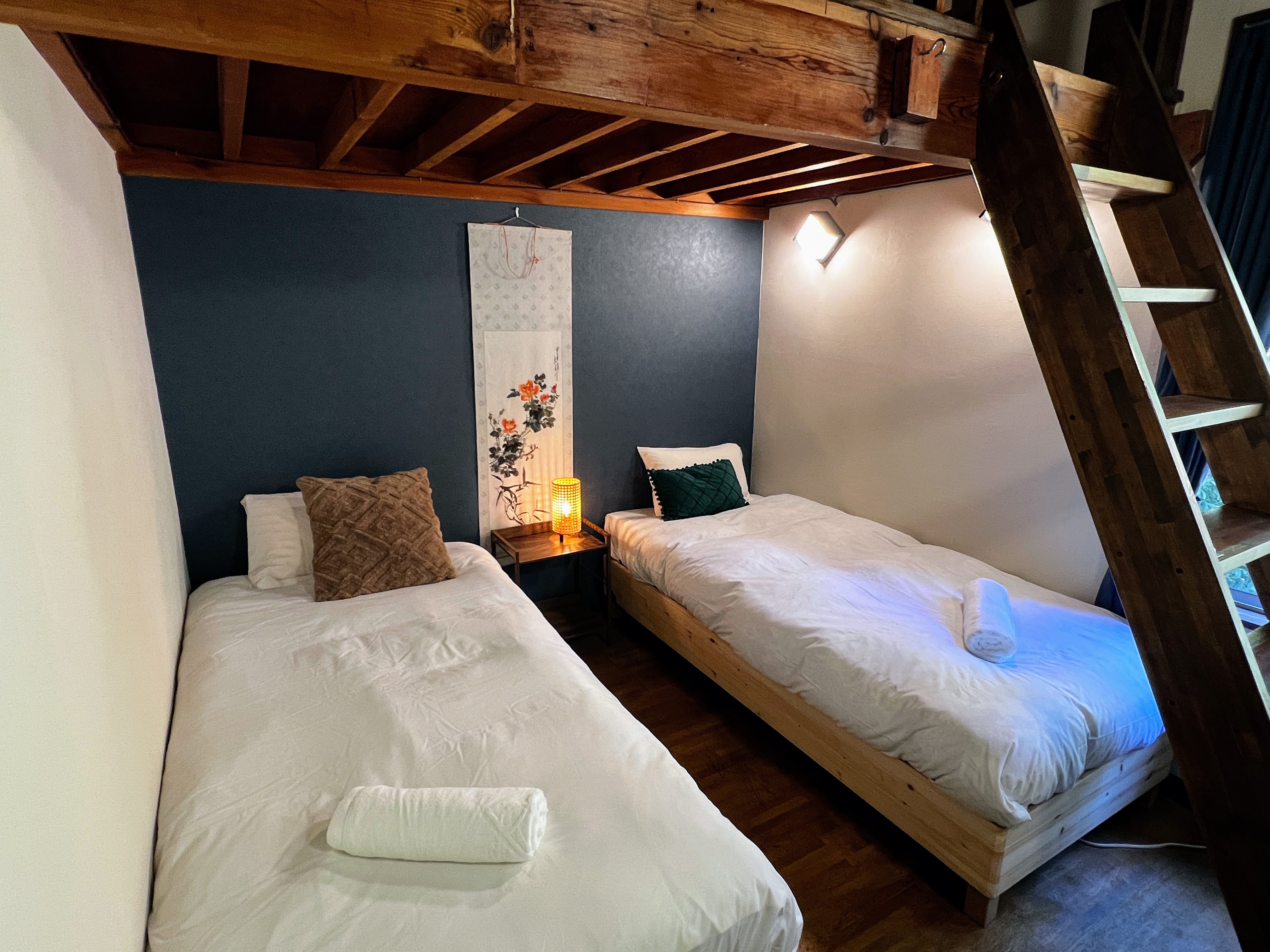 This room features a modern, Western-style layout with twin beds that can be configured as a king. Perfect for guests looking for comfort and flexibility.