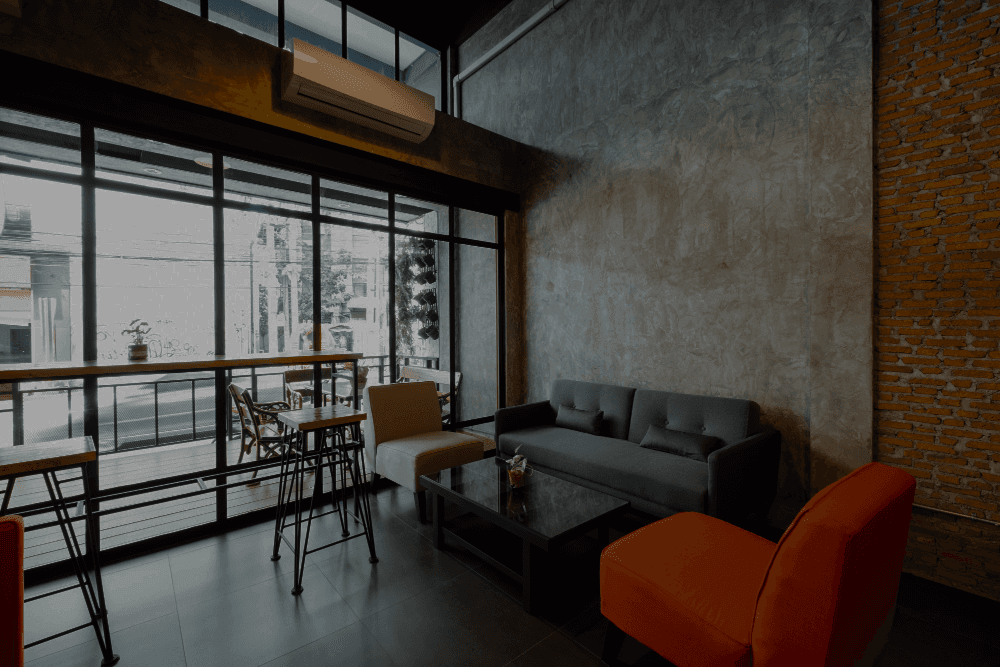 A fast black sports car races down the highway.