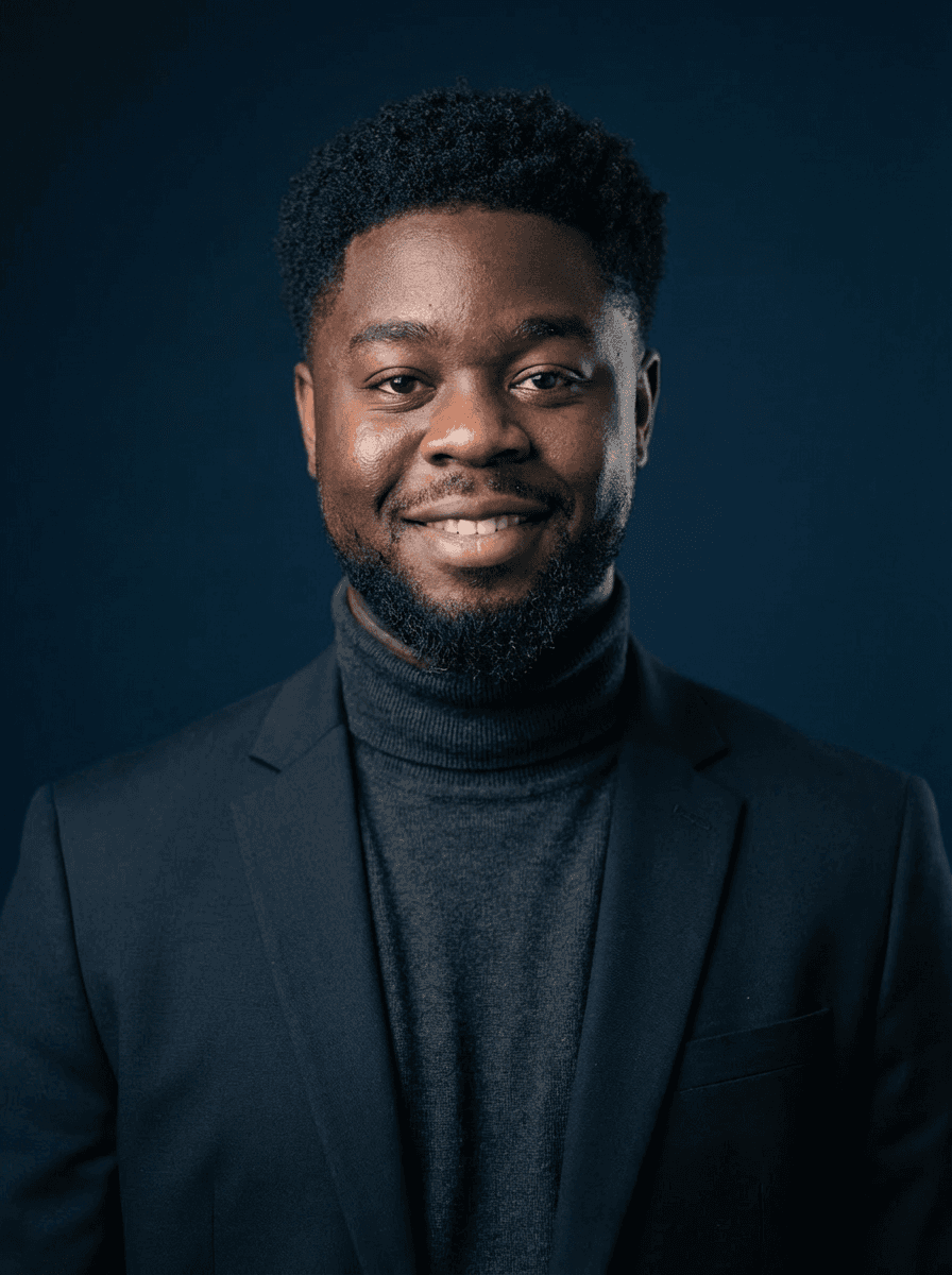 Young woman in a white shirt with a colorful gradient print, against a plain background.