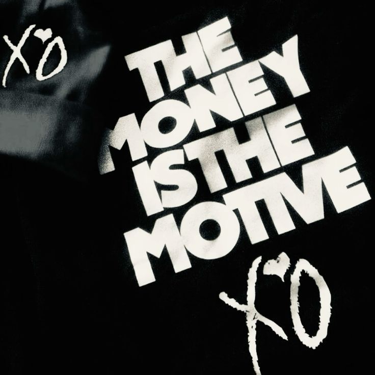 gold and black bottle on white wooden table