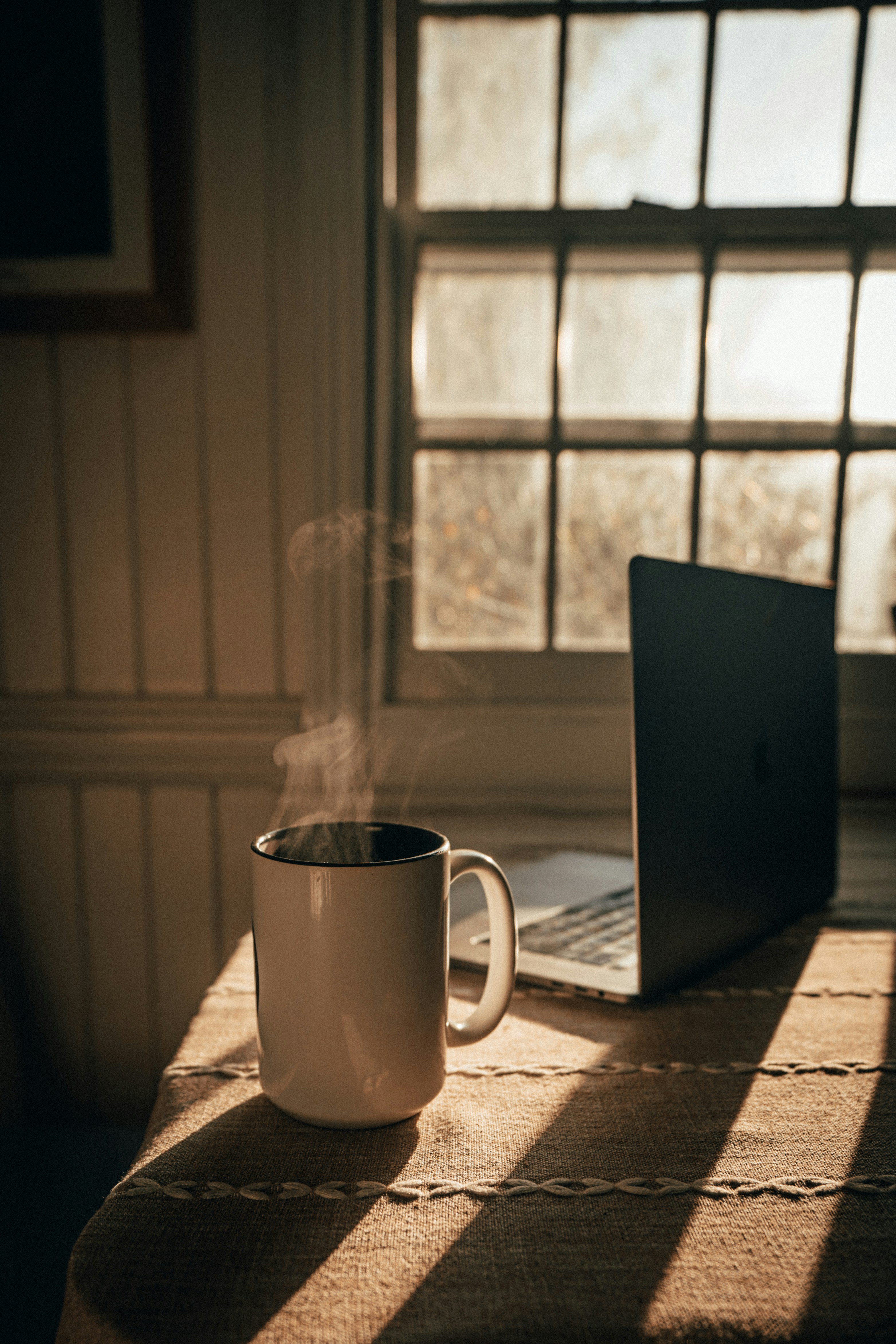 Mug with hot drink on a table
