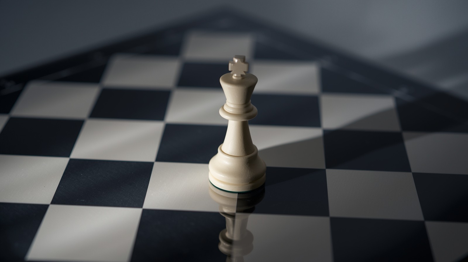 Create a highly detailed image of a king in check by a pawn and a bishop positioned on a glossy black and white chessboard