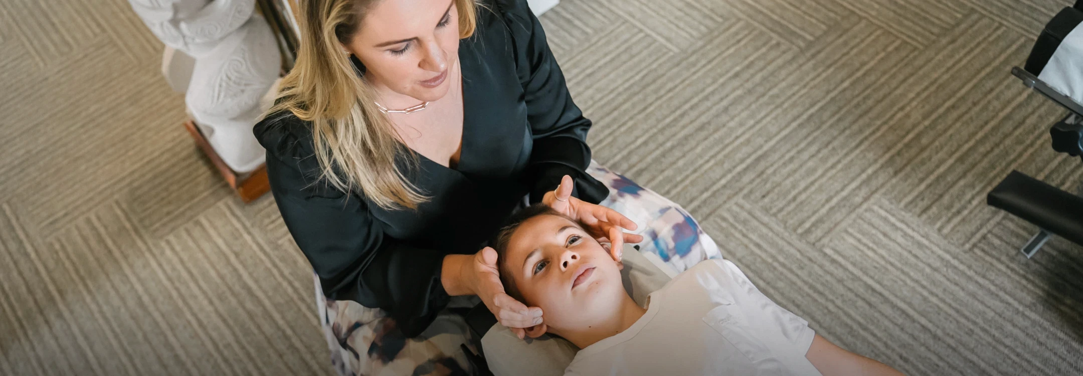 Teenager getting chiropractic adjustment