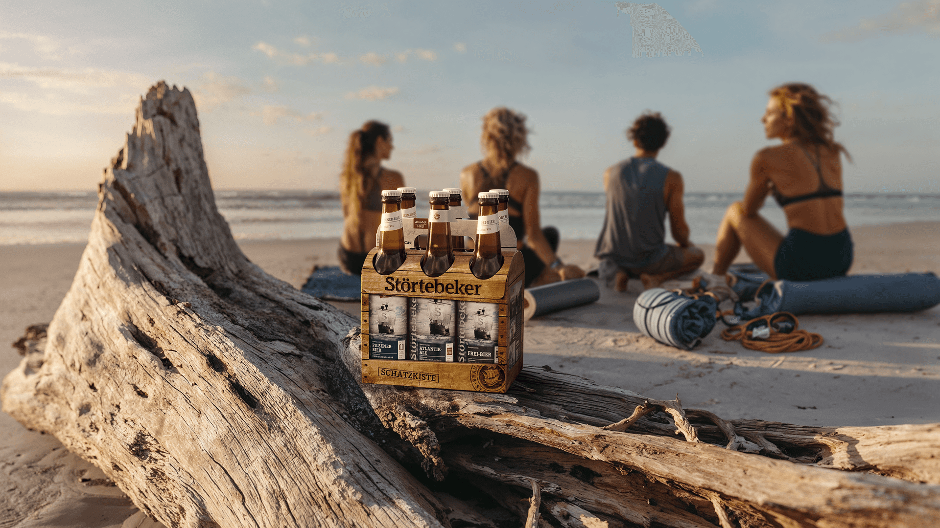 Störtebeker beer six-pack on driftwood at beach