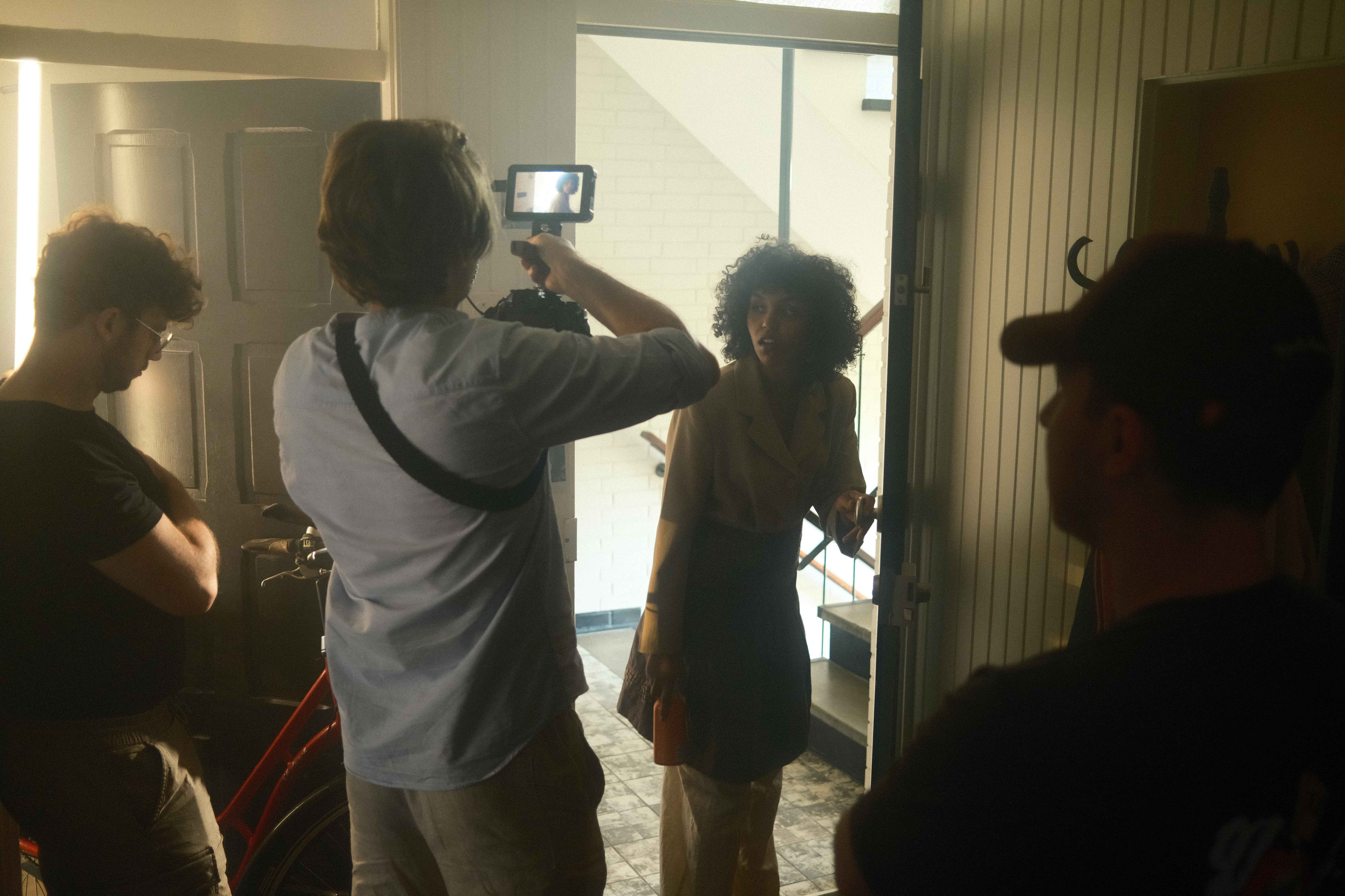 Streetside billboard with flyposters of the Batch.Works brand and illustrations