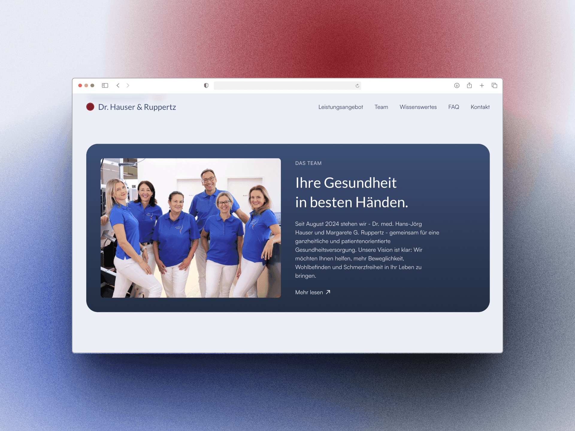 Group of five people in blue shirts smiling together, with a professional backdrop displayed on a screen.