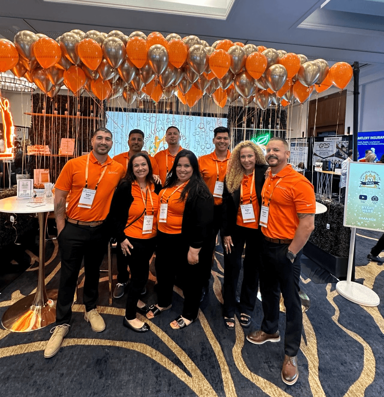 Gemini Legal Sales Team at CAAA 2024 Workers' Comp Convention Booth with Balloons