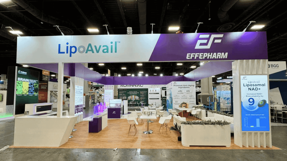 Nutrition product display booth with ingredient messaging, sample handling area, meeting space, and clean booth layout