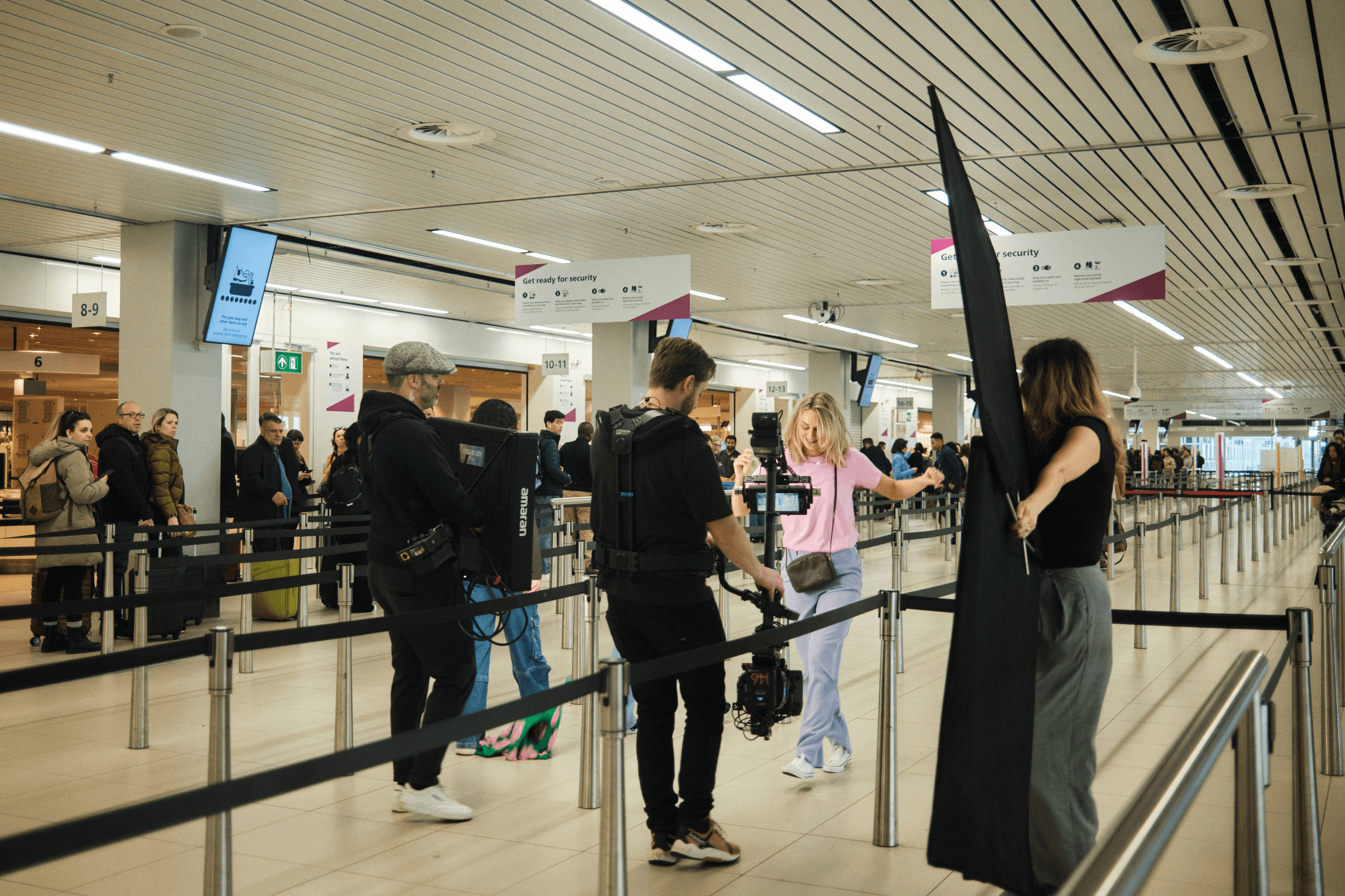 The image captures the ethereal beauty of an underwater cave illuminated by sunbeams penetrating through an opening above.