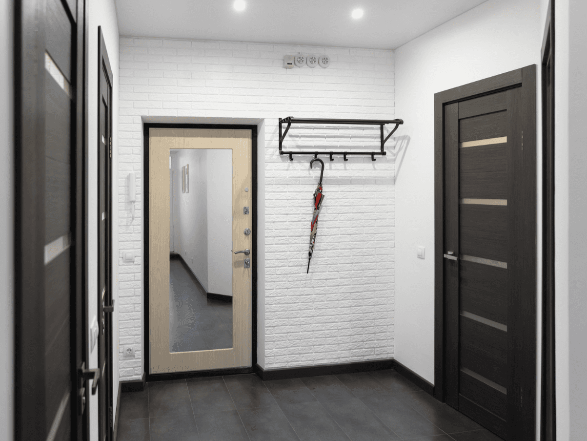 mountain valley with green grass and little village in the middle