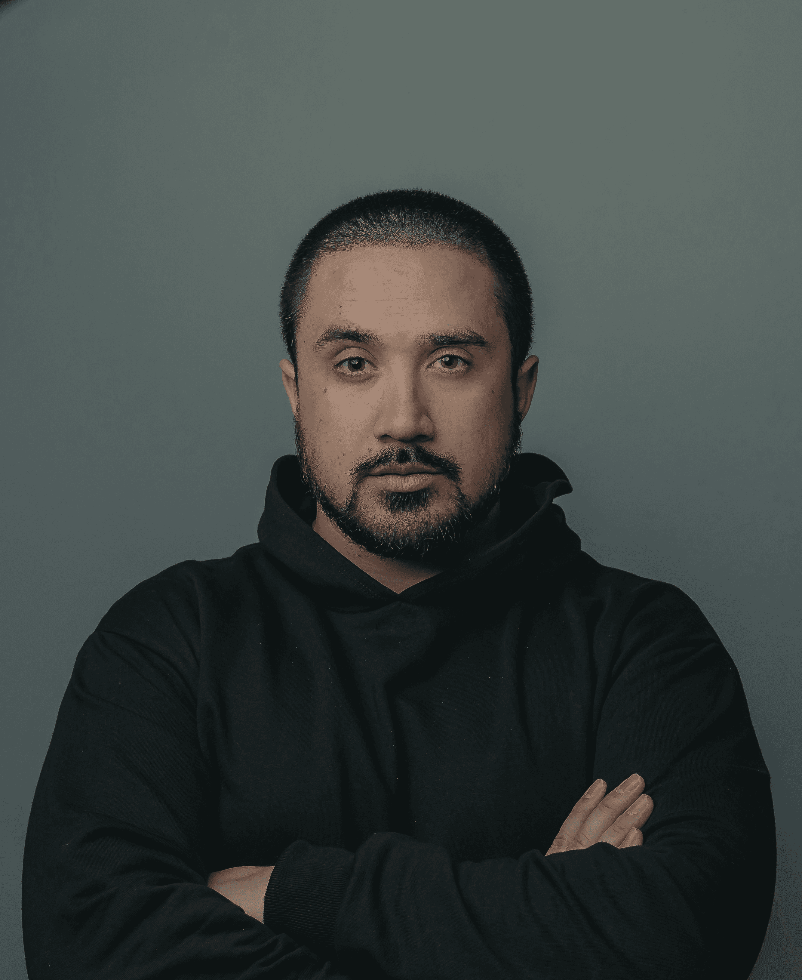 man in black hoodie standing