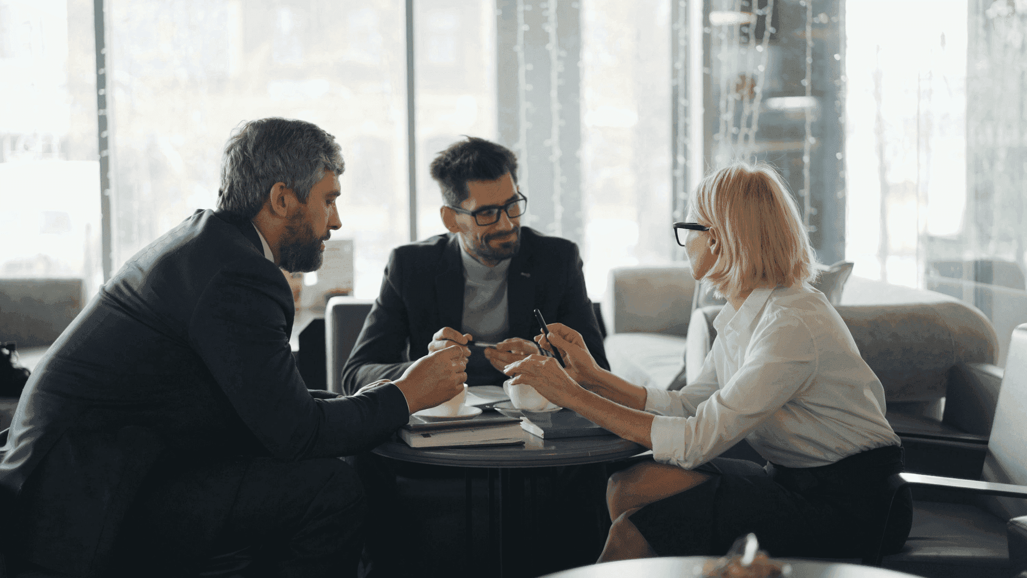 Family lawyer consulting a client at a table with documents