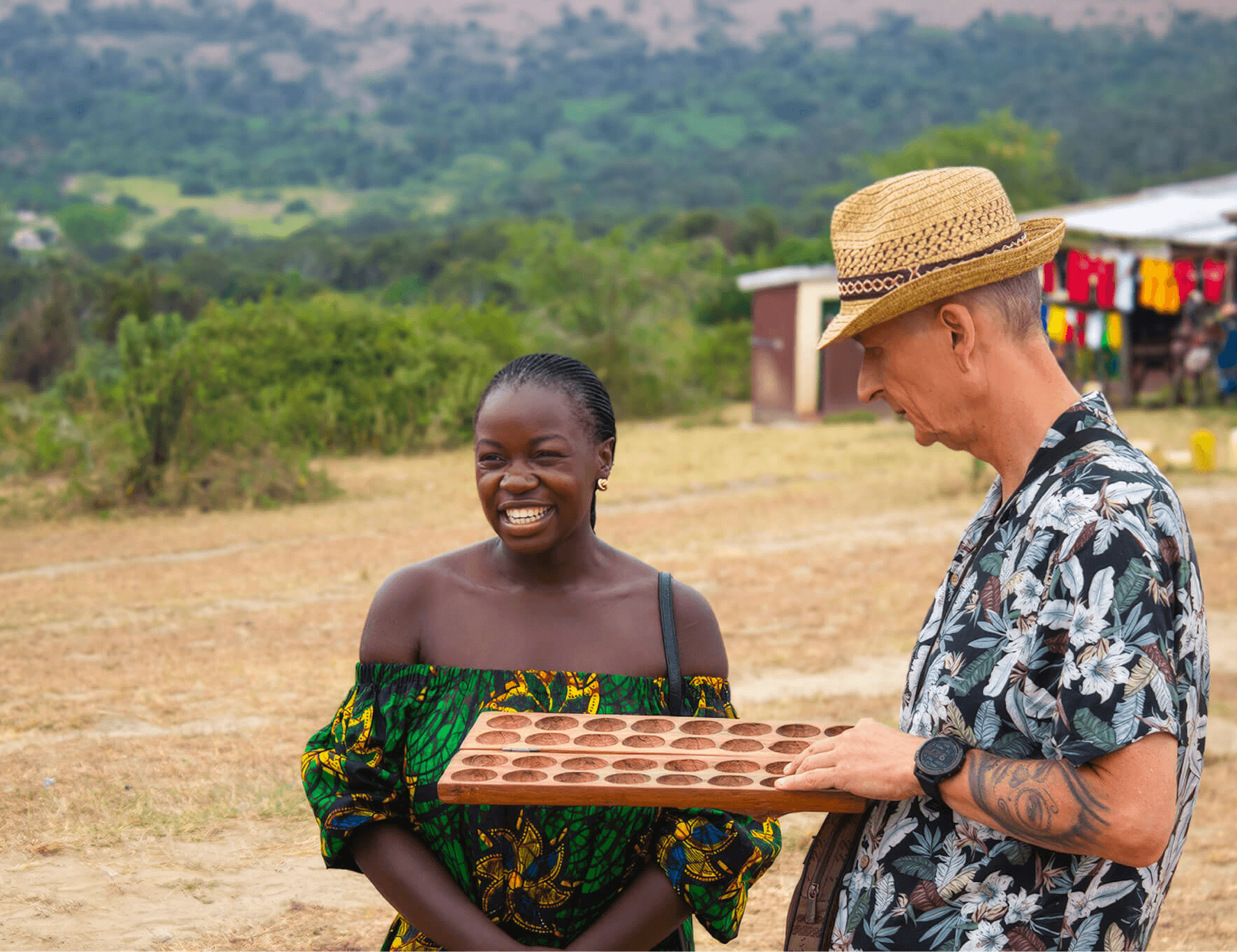 Mary smiles while meeting a local resident in Uganda