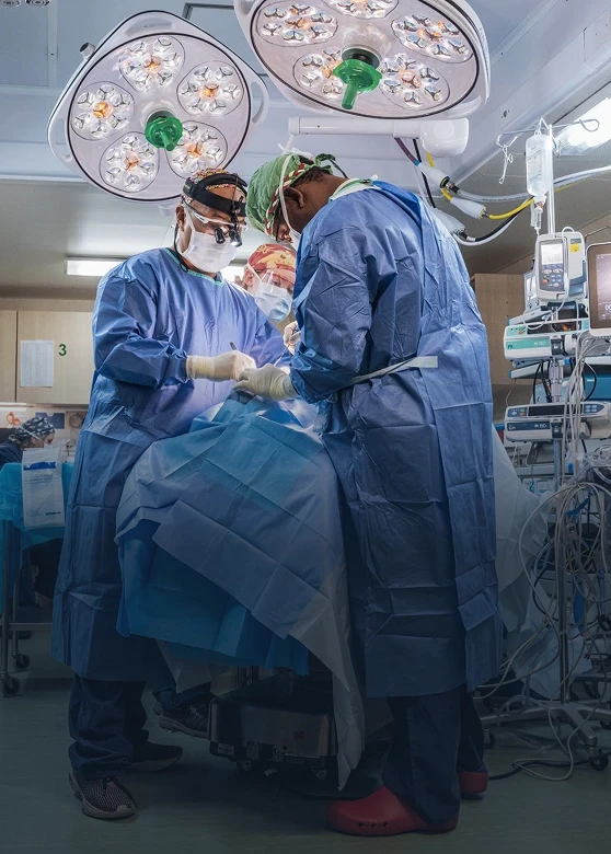 Surgeon volunteers doing a procedure