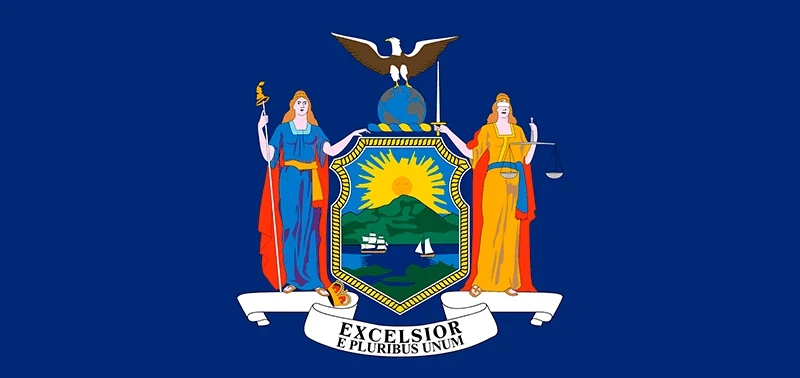 Flag of New York: A deep blue background features a central coat of arms with a rising sun, shield, and two allegorical female figures. An eagle tops the globe, and the motto “Excelsior, E Pluribus Unum” is displayed on a white ribbon.