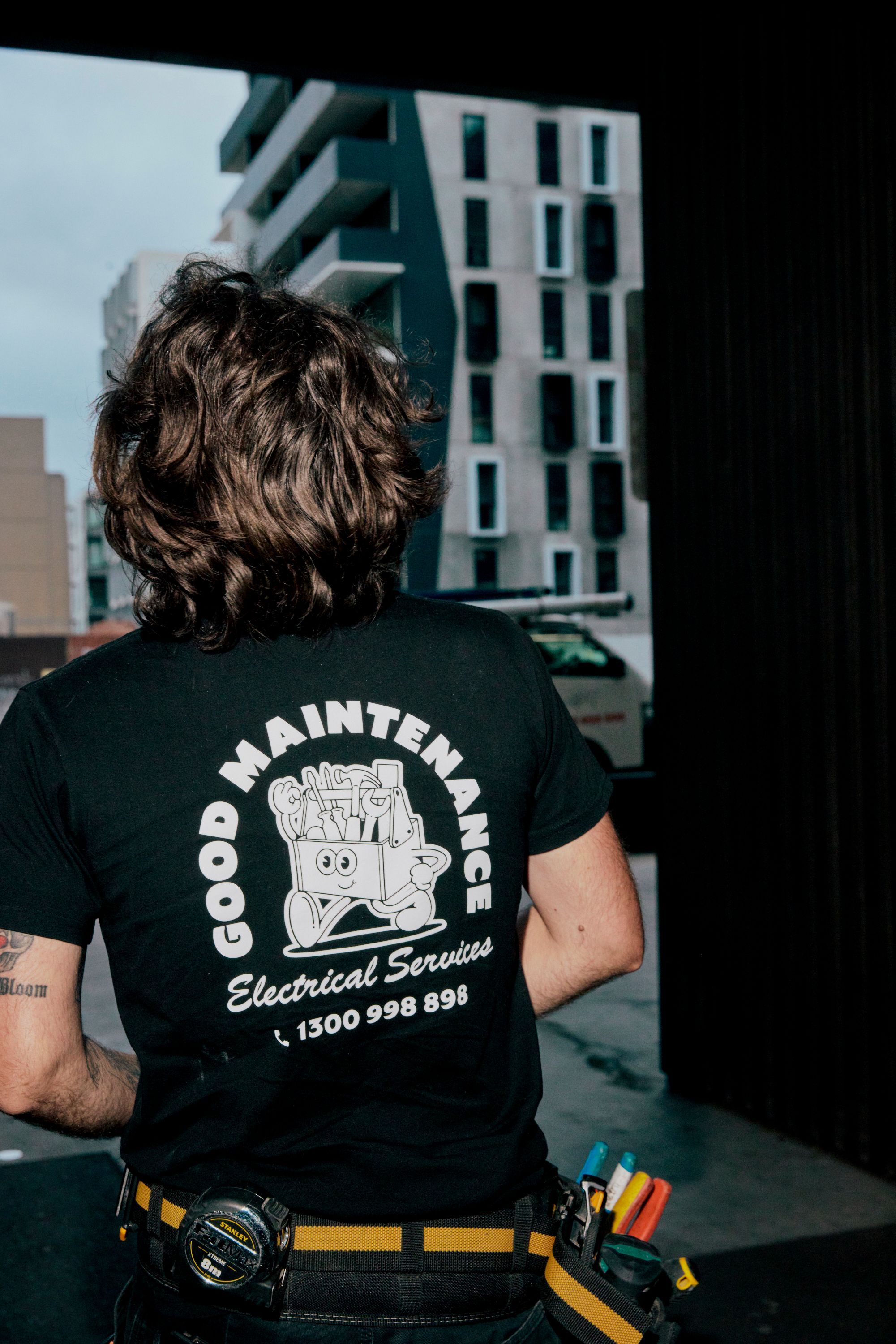 Good Maintenance technician unloading tools from service van for air conditioning repair in Melbourne.