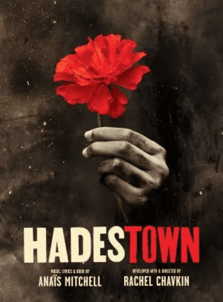 Hadestown tickets in London. A hand holds a red carnation by the stem.
