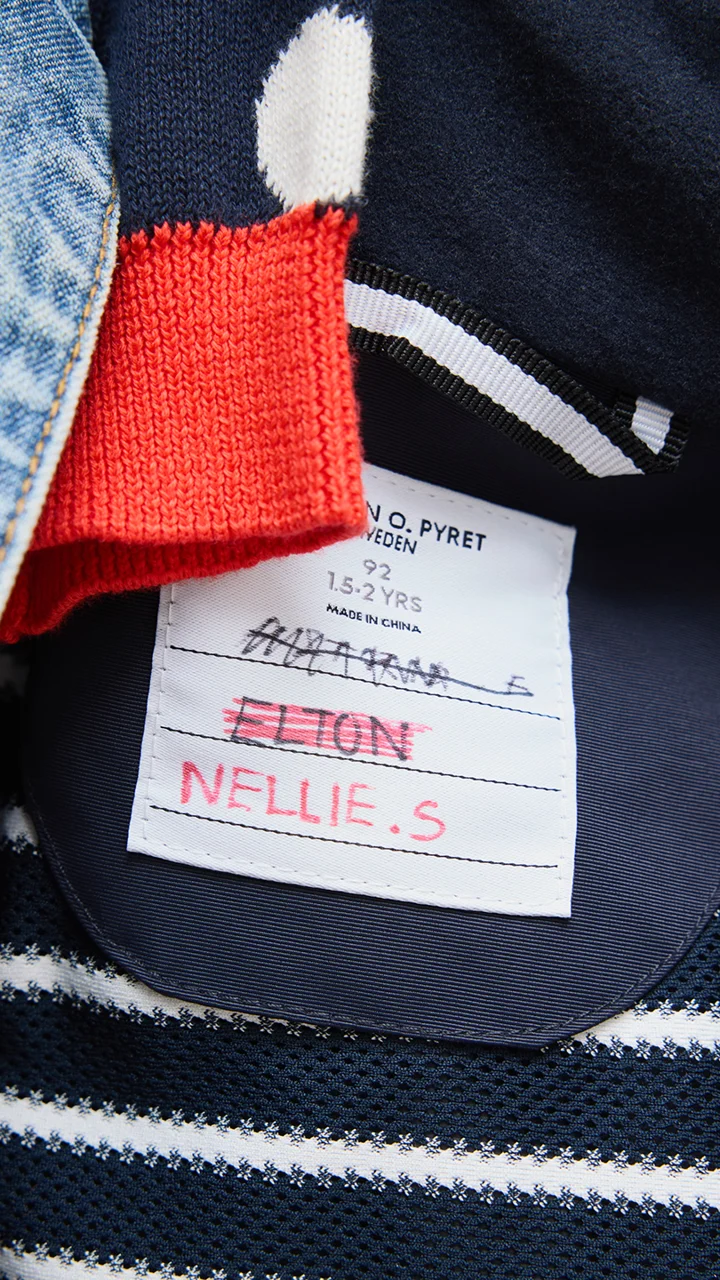 two people looking at a tablet and smiling